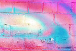 A fragment of colorful graffiti painted on a wall. Abstract urban background. photo
