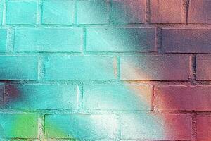 A fragment of colorful graffiti painted on a wall. Abstract urban background. photo