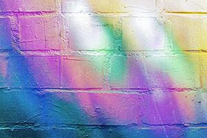 A fragment of colorful graffiti painted on a wall. Abstract urban background. photo