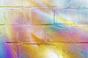A fragment of colorful graffiti painted on a wall. Abstract urban background. photo