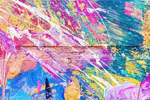 A fragment of colorful graffiti painted on a wall. Abstract urban background. photo