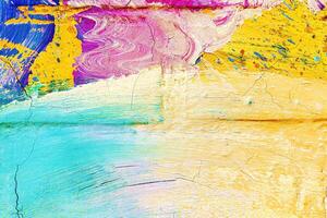 A fragment of colorful graffiti painted on a wall. Abstract urban background. photo