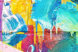 A fragment of colorful graffiti painted on a wall. Abstract urban background. photo