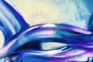 A fragment of colorful graffiti painted on a wall. Abstract urban background. photo