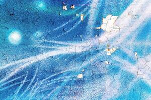 A fragment of colorful graffiti painted on a wall. Abstract urban background. photo