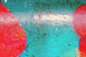 A fragment of colorful graffiti painted on a wall. Abstract urban background. photo
