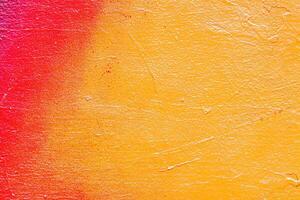 A fragment of colorful graffiti painted on a wall. Abstract urban background. photo