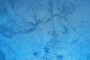 Texture of blue decorative plaster or concrete. Abstract grunge background. photo