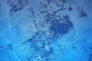 Texture of blue decorative plaster or concrete. Abstract grunge background. photo