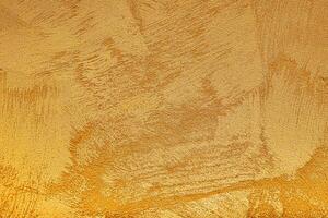 Texture of golden decorative plaster or concrete. Abstract grunge background. photo