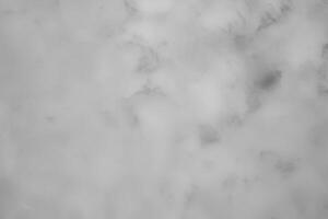 Blured gray decorative plaster or concrete. Abstract grunge background for design. photo