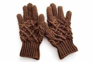 Cozy brown knit gloves with intricate patterns displayed on white background. Winter fashion detail photo