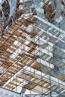 Scaffolding without people on the reconstruction of a historic building. photo