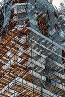 Scaffolding without people on the reconstruction of a historic building. photo