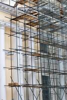 Scaffolding without people on the reconstruction of a historic building. photo