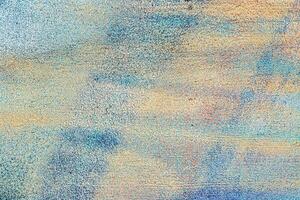 A fragment of colorful graffiti painted on a wall. Abstract urban background. photo