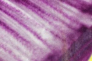 A fragment of colorful graffiti painted on a wall. Abstract urban background. photo