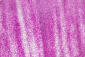 A fragment of colorful graffiti painted on a wall. Abstract urban background. photo