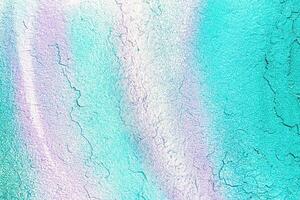 A fragment of colorful graffiti painted on a wall. Abstract urban background. photo