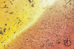 A fragment of colorful graffiti painted on a wall. Abstract urban background. photo