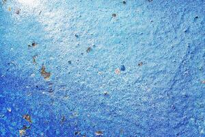 A fragment of colorful graffiti painted on a wall. Abstract urban background. photo