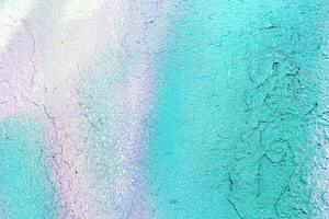 A fragment of colorful graffiti painted on a wall. Abstract urban background. photo