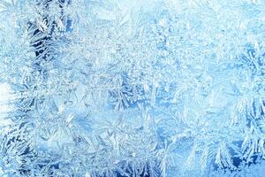 The texture of the glass covered with frost in winter in cold weather. Abstract background. photo