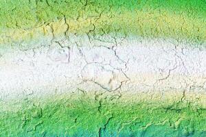 A fragment of colorful graffiti painted on a wall. Abstract urban background. photo