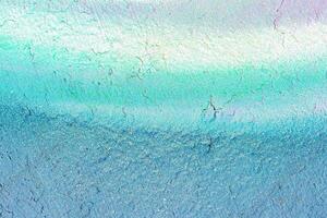 A fragment of colorful graffiti painted on a wall. Abstract urban background. photo
