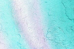 A fragment of colorful graffiti painted on a wall. Abstract urban background. photo