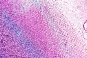 A fragment of colorful graffiti painted on a wall. Abstract urban background. photo