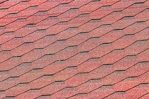 The texture of red tile roof covering. photo