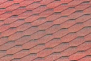 The texture of red tile roof covering. photo