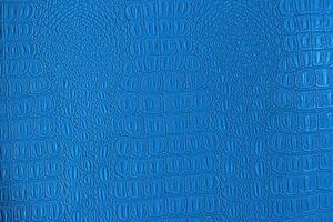 Blue crocodile leather texture. Abstract backdrop for design. photo