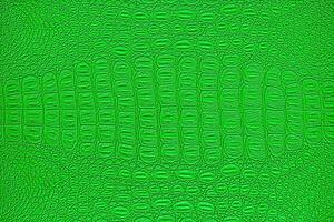 Green crocodile leather texture. Abstract backdrop for design. photo