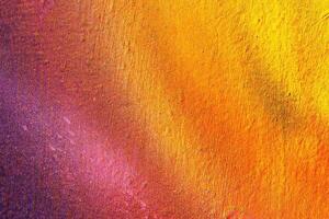 A fragment of colorful graffiti painted on a wall. Abstract urban background. photo