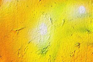 A fragment of colorful graffiti painted on a wall. Abstract urban background. photo