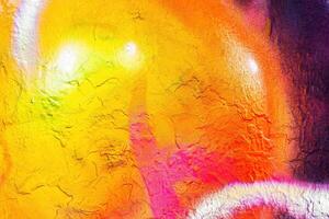 A fragment of colorful graffiti painted on a wall. Abstract urban background. photo