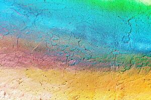 A fragment of colorful graffiti painted on a wall. Abstract urban background. photo