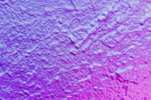 A fragment of colorful graffiti painted on a wall. Abstract urban background. photo