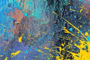 A fragment of colorful graffiti painted on a wall. Abstract urban background. photo