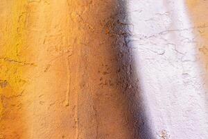 A fragment of colorful graffiti painted on a wall. Abstract urban background. photo