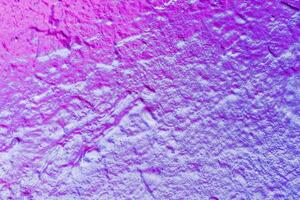 A fragment of colorful graffiti painted on a wall. Abstract urban background. photo