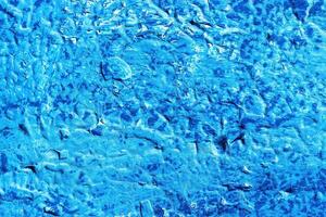 A fragment of colorful graffiti painted on a wall. Abstract urban background. photo