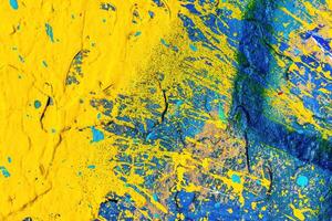 A fragment of colorful graffiti painted on a wall. Abstract urban background. photo