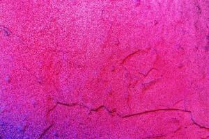 A fragment of colorful graffiti painted on a wall. Abstract urban background. photo