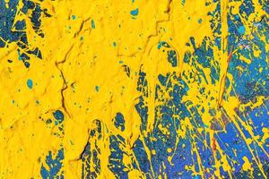 A fragment of colorful graffiti painted on a wall. Abstract urban background. photo