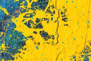 A fragment of colorful graffiti painted on a wall. Abstract urban background. photo