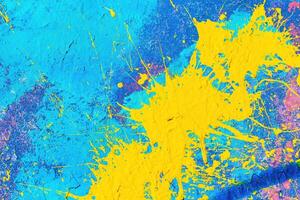 A fragment of colorful graffiti painted on a wall. Abstract urban background. photo