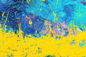 A fragment of colorful graffiti painted on a wall. Abstract urban background. photo